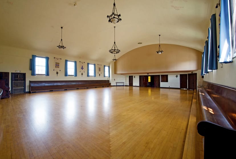 Spacious Finnish Hall event center with high ceilings, ideal for gatherings and workshops.