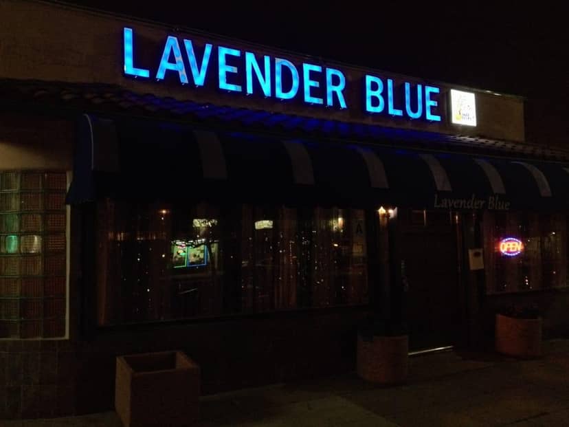Lavender Blue Sports Lounge with vibrant blue signage, perfect for evening events and gatherings.