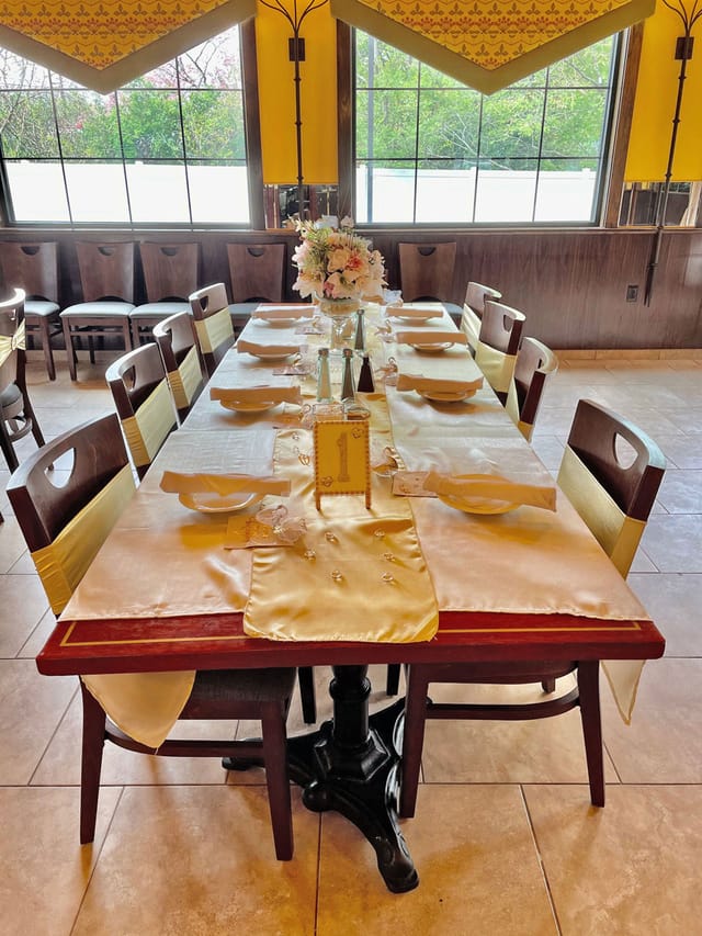 Elegant banquet hall dining table with sophisticated decor for formal events.