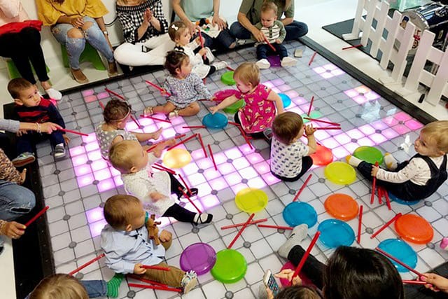 Vibrant children's play area with colorful mats for family-friendly events and birthday parties.