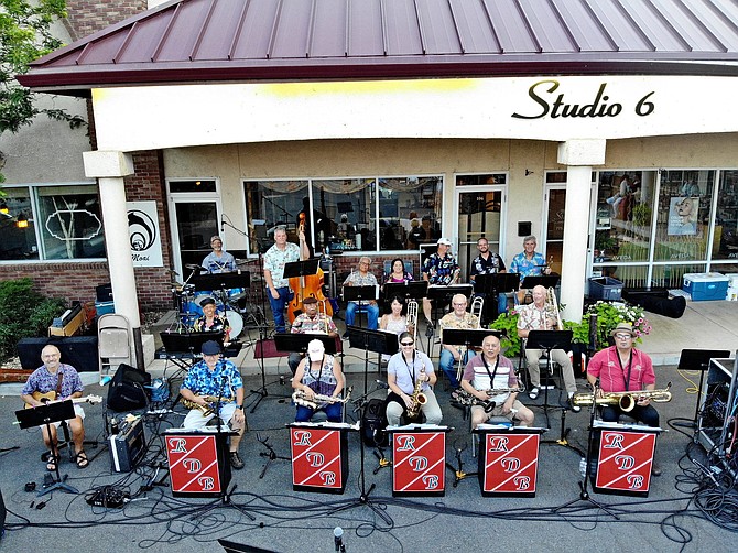 Lively outdoor band performance on a stage at The Main Plaza for summer events.