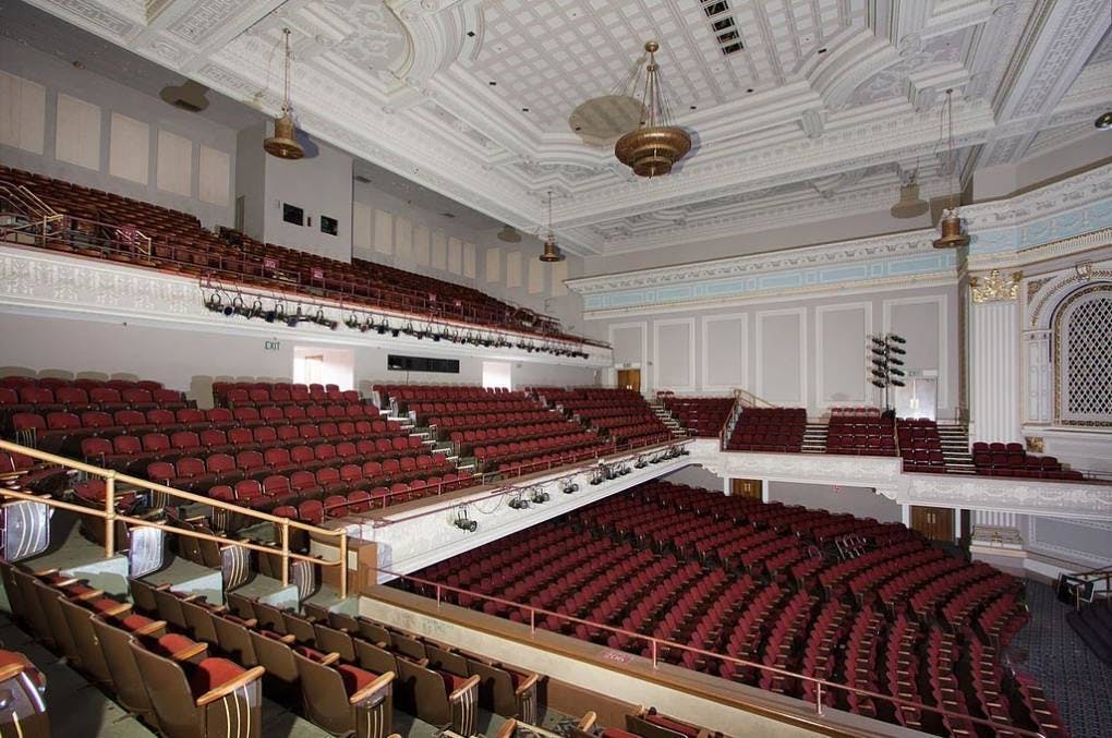 Spacious auditorium with tiered seating at Henry J. Kaiser Center for conferences and performances.