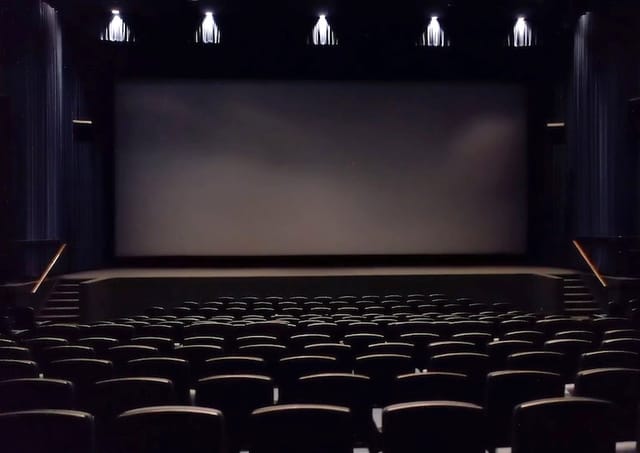 Spacious Harmony Gold theater with tiered seating for corporate events and film screenings.