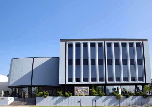 Modern Harmony Gold movie theater with large windows, ideal for events and meetings.