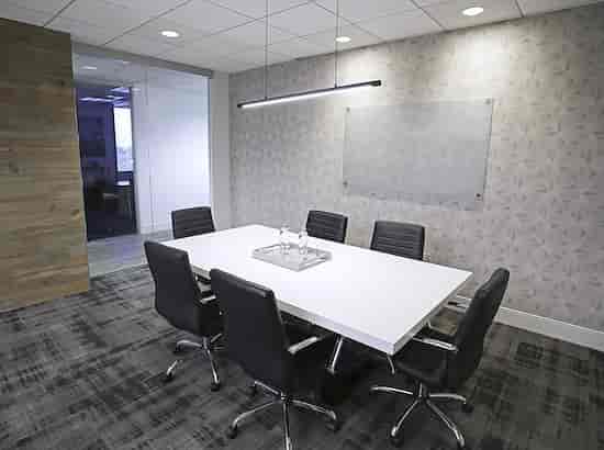 Modern conference room with sleek table and ergonomic chairs for effective meetings.