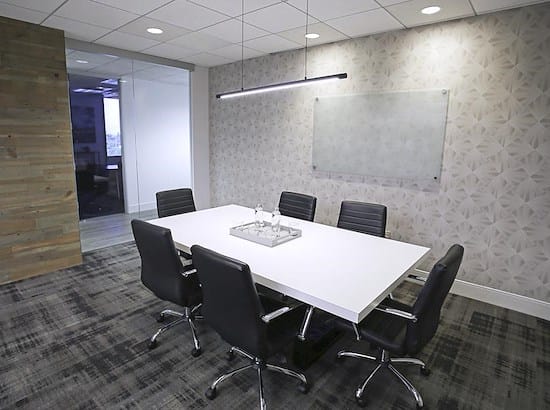 Modern conference room with sleek table and ergonomic chairs for effective meetings.