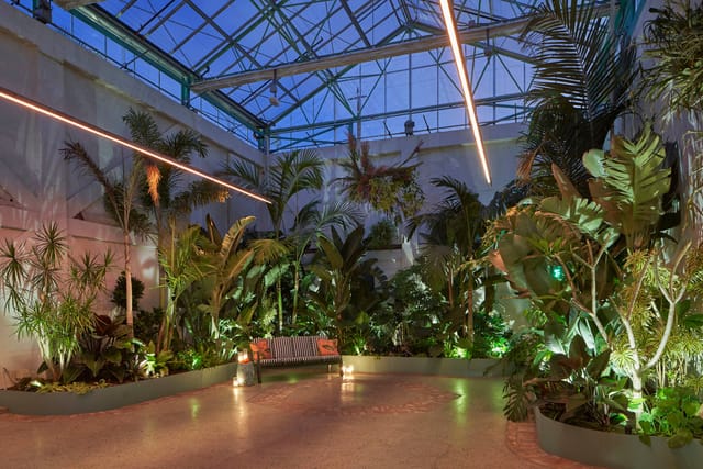"Valentine DTLA indoor event space with lush greenery, ideal for networking and gatherings."