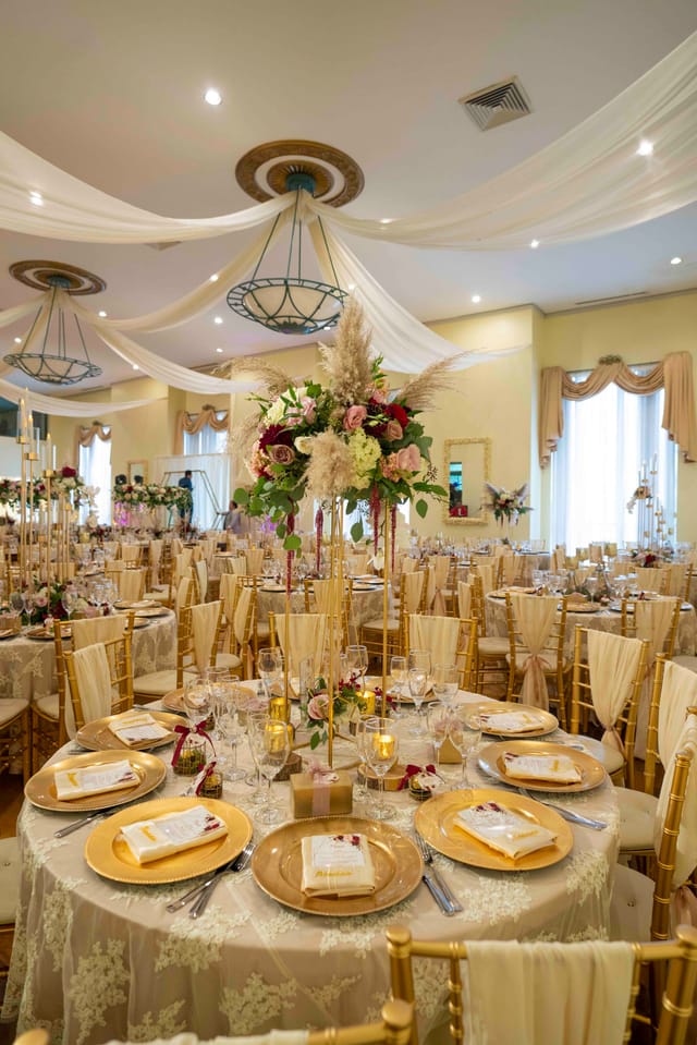 Elegant Grand Ballroom with floral centerpieces for upscale weddings and events.