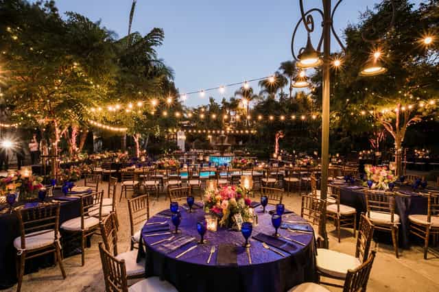 Elegant outdoor dance floor with floral centerpieces for Los Angeles garden weddings.