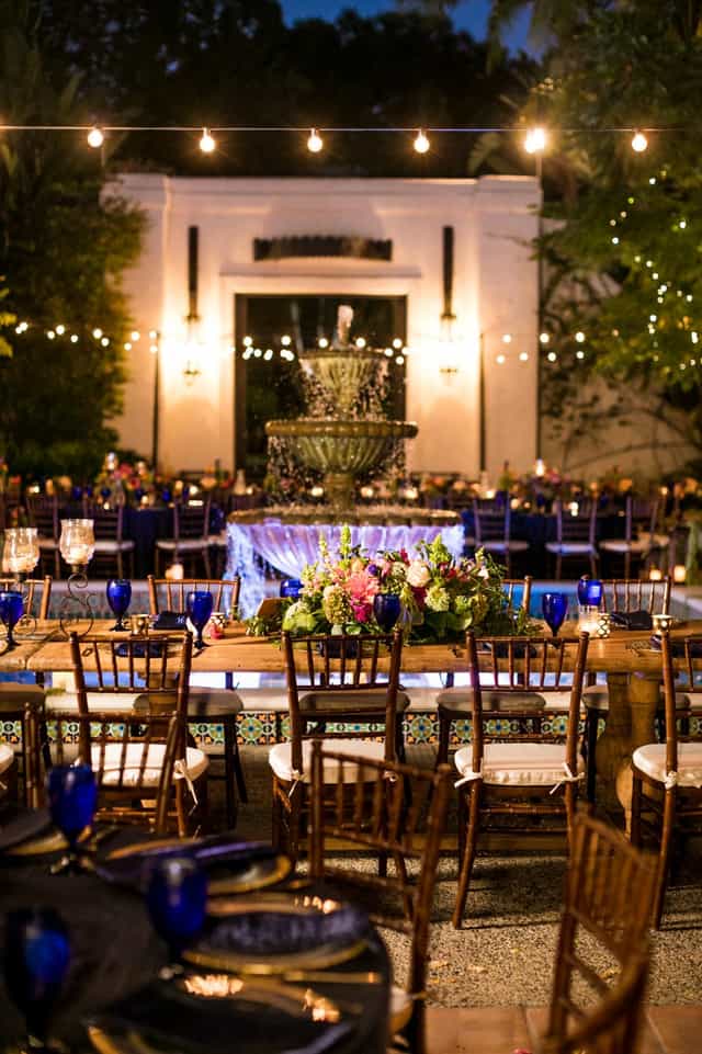 Elegant outdoor dance floor with fountain, floral decor for Los Angeles garden weddings.