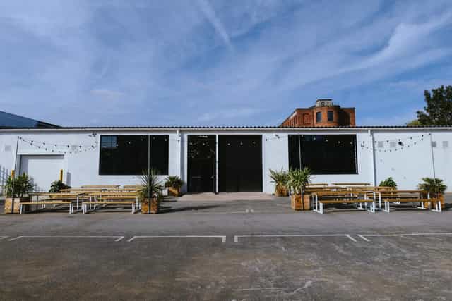 Modern event space with large windows, perfect for corporate meetings and social gatherings.