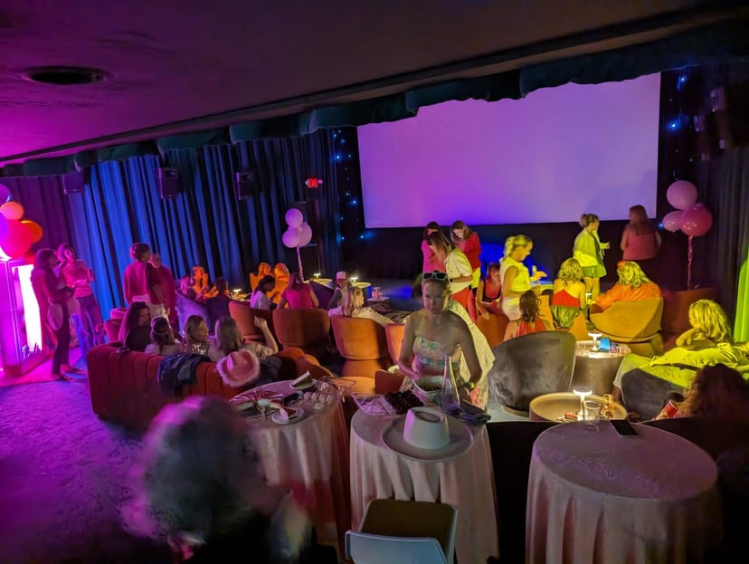 Vibrant event space at Cinelounge Cinemas with colorful lighting for networking gatherings.