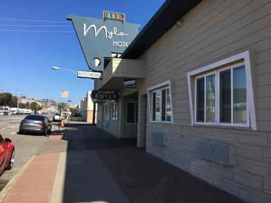 Modest Mylo Hotel exterior with signage, ideal for budget-friendly events and gatherings.