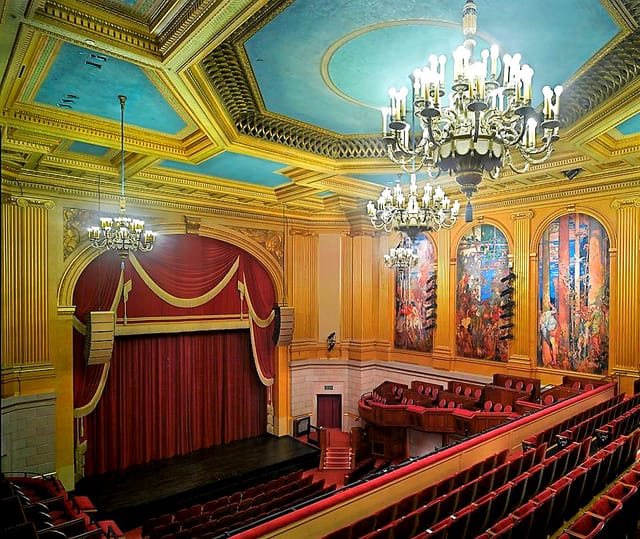 Herbst Theatre auditorium with ornate gold detailing, ideal for elegant events and performances.