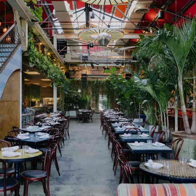 Vibrant event space with lush greenery for elegant birthday and corporate celebrations.