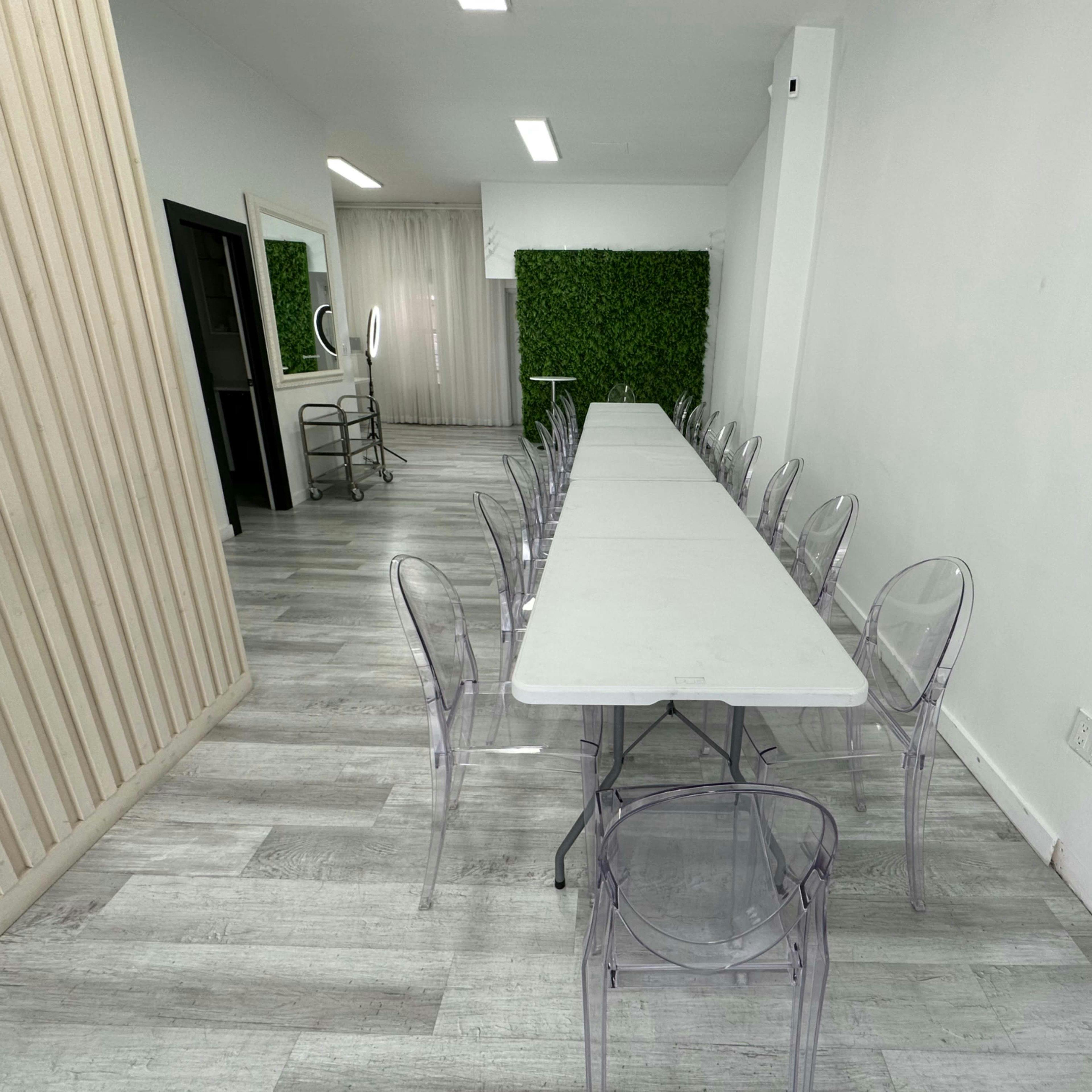 Modern meeting space with acrylic chairs for product launches and events.