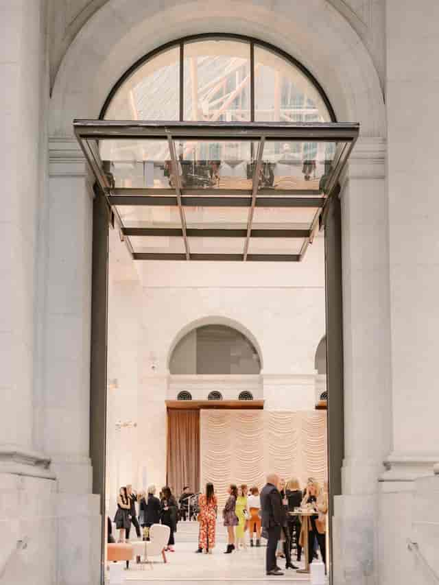 Elegant venue entrance with glass ceiling, perfect for upscale corporate events.