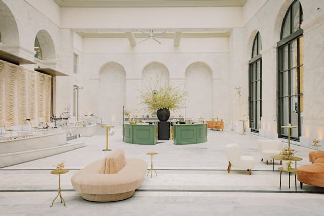 Elegant event venue with high ceilings and natural light for upscale meetings and gatherings.