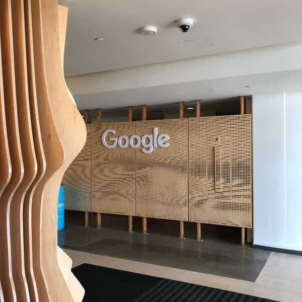 Modern coworking area with Google logo, perfect for networking and events.