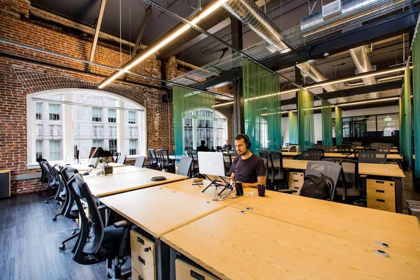 Modern coworking area with flexible seating in Google's Community Space for events.