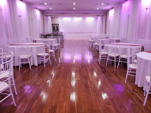 Ridgewood Hall event space with elegant chairs, ideal for weddings and corporate events.