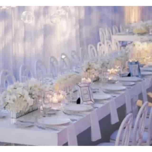 Elegant banquet table with floral centerpieces for upscale weddings and corporate events.