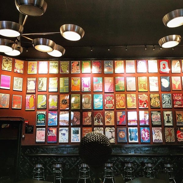 Vibrant poster wall in The Fillmore, perfect for creative networking events.