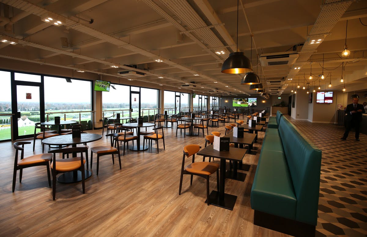 Spacious 1875 Lounge at Sandown Park, ideal for meetings and events with scenic views.