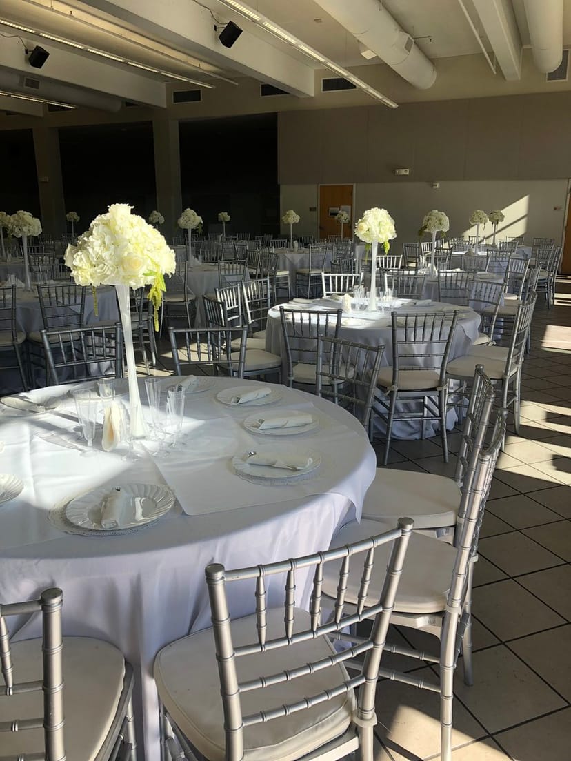 Elegant Donworth Hall event space with round tables, ideal for weddings and corporate events.