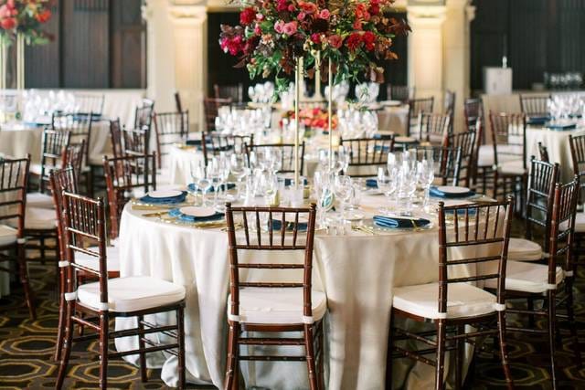 Elegant banquet hall with floral centerpieces, perfect for weddings and corporate events.