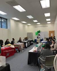 Mission Hiring Hall event space with colorful tables for networking and meetings.