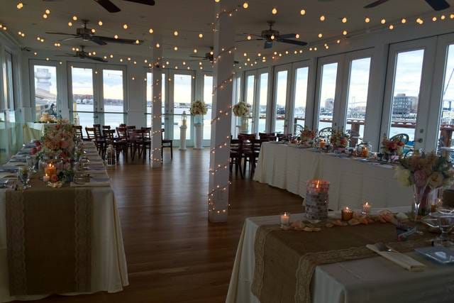 Elegant banquet hall with waterfront view, ideal for weddings and upscale receptions.
