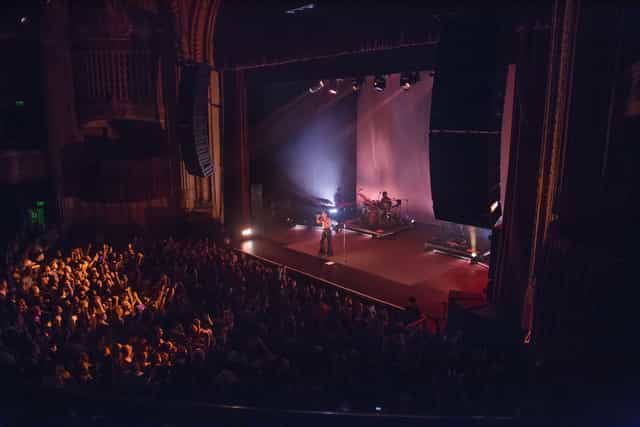 Vibrant live performance in The Warfield event space with engaging crowd and stunning acoustics.
