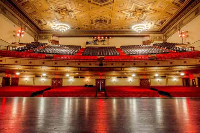 Sydney Goldstein Theater with elegant architecture and red seating, ideal for events.