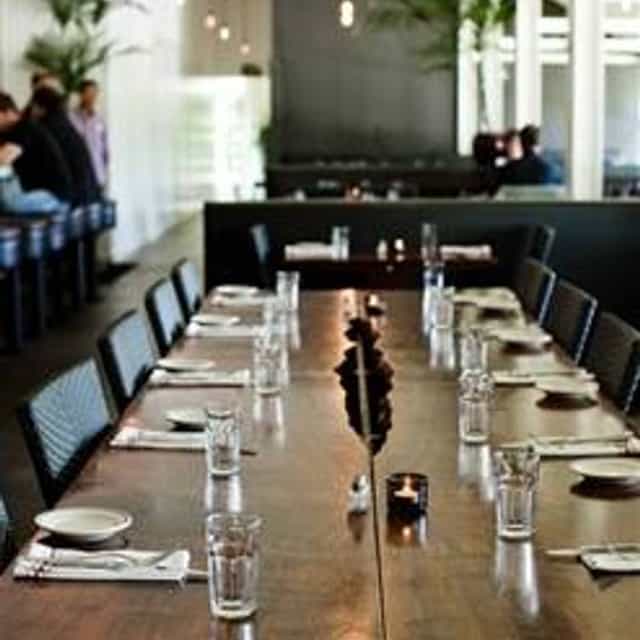 Modern dining setup at Presidio Social Club for intimate gatherings and corporate meetings.