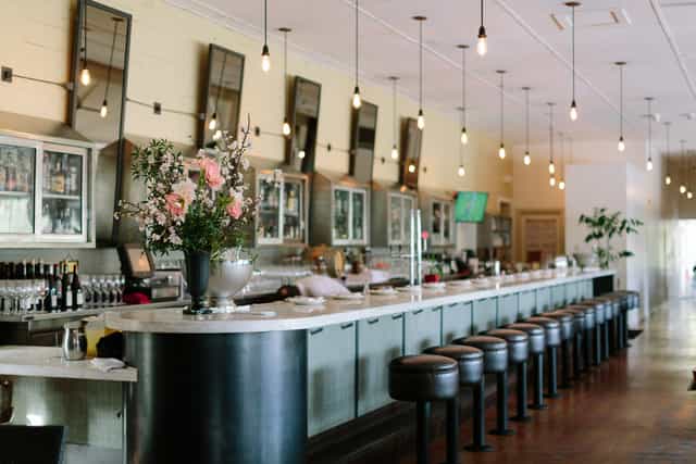Stylish bar at Presidio Social Club, ideal for networking events and gatherings.