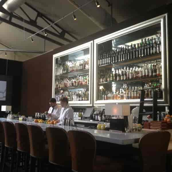 Sleek bar in Spruce with premium spirits, ideal for networking and cocktail receptions.