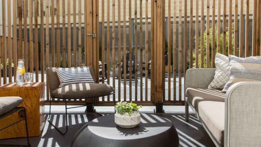 Stylish outdoor lounge at Kimpton Hotel Enso, perfect for networking and casual meetings.