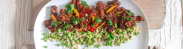 Vibrant beef dish with bell peppers and rice at The W Bar, perfect for events and catering.