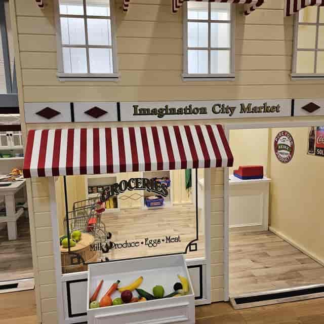 Miniature storefront "Imagination City Market" in Foster City Community Center for themed events.