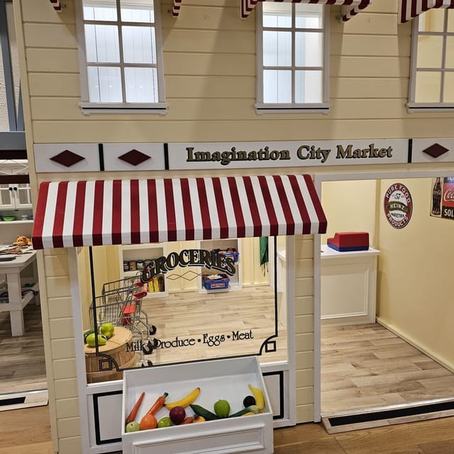 Miniature storefront "Imagination City Market" in Foster City Community Center for themed events.