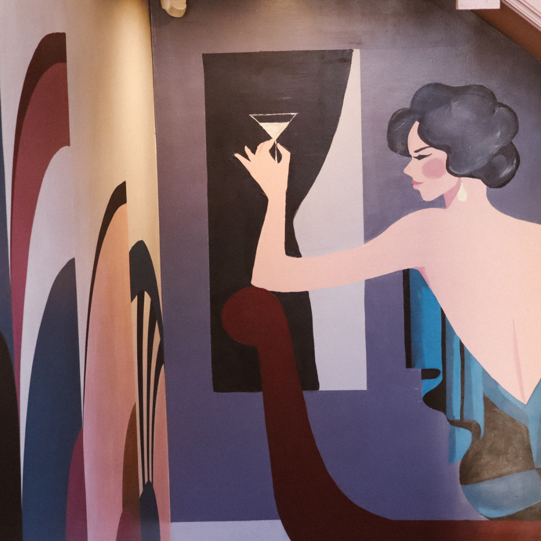 Stylish mural of a figure with martini in The Gipsy Queen for elegant cocktail events. - Banner