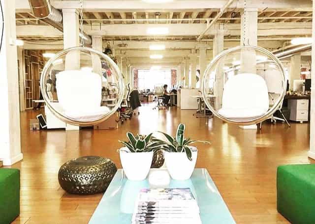 EcoSystem Coworking at Temple Nightclub with unique hanging chairs for creative meetings.