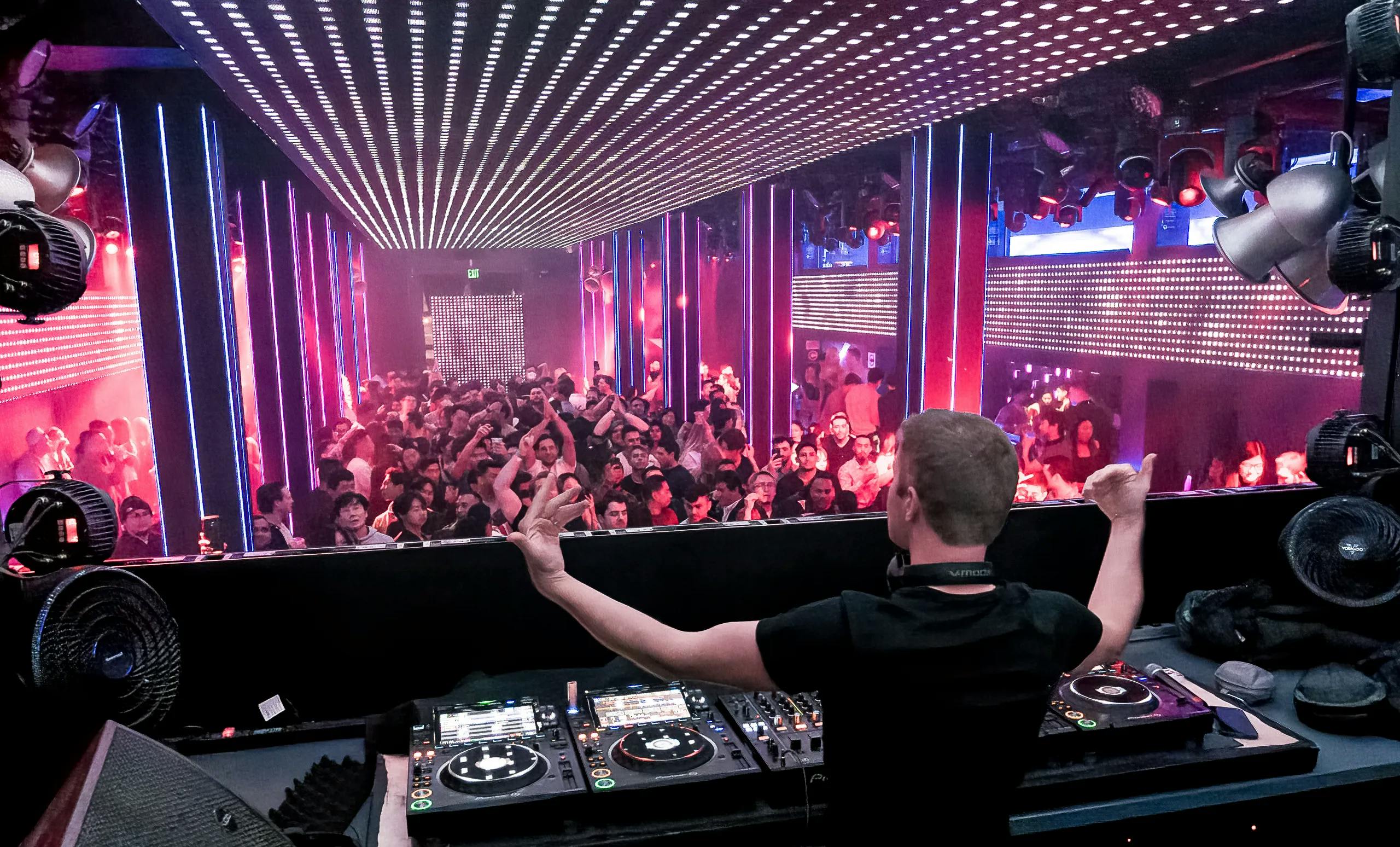 "Temple Nightclub Main Room DJ energizes crowd at vibrant nightlife event"