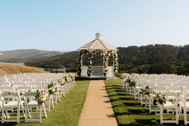 Outdoor wedding venue with floral gazebo and scenic hills at Fairview Crystal Springs.