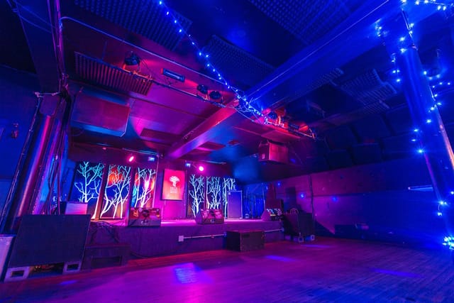 Main Stage at Neck of the Woods with vibrant lighting for live performances and events.