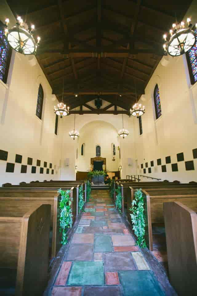 Presidio Chapel event space with stained glass, perfect for weddings and ceremonies.