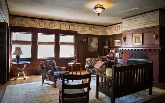 Historic Arts & Crafts Chapel with rich wood paneling, ideal for intimate gatherings.