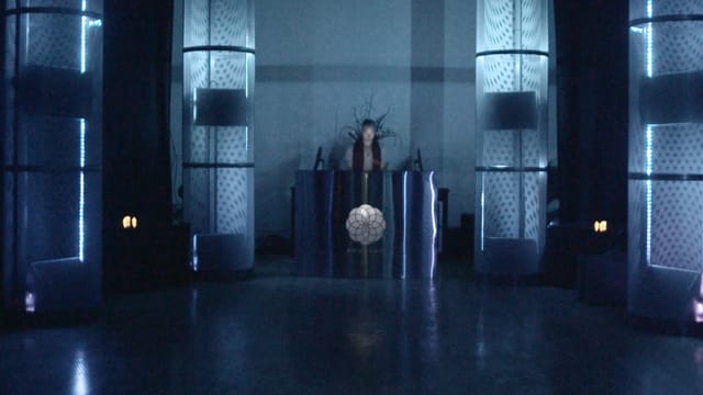 Sleek event space with blue lighting, ideal for corporate events and presentations.
