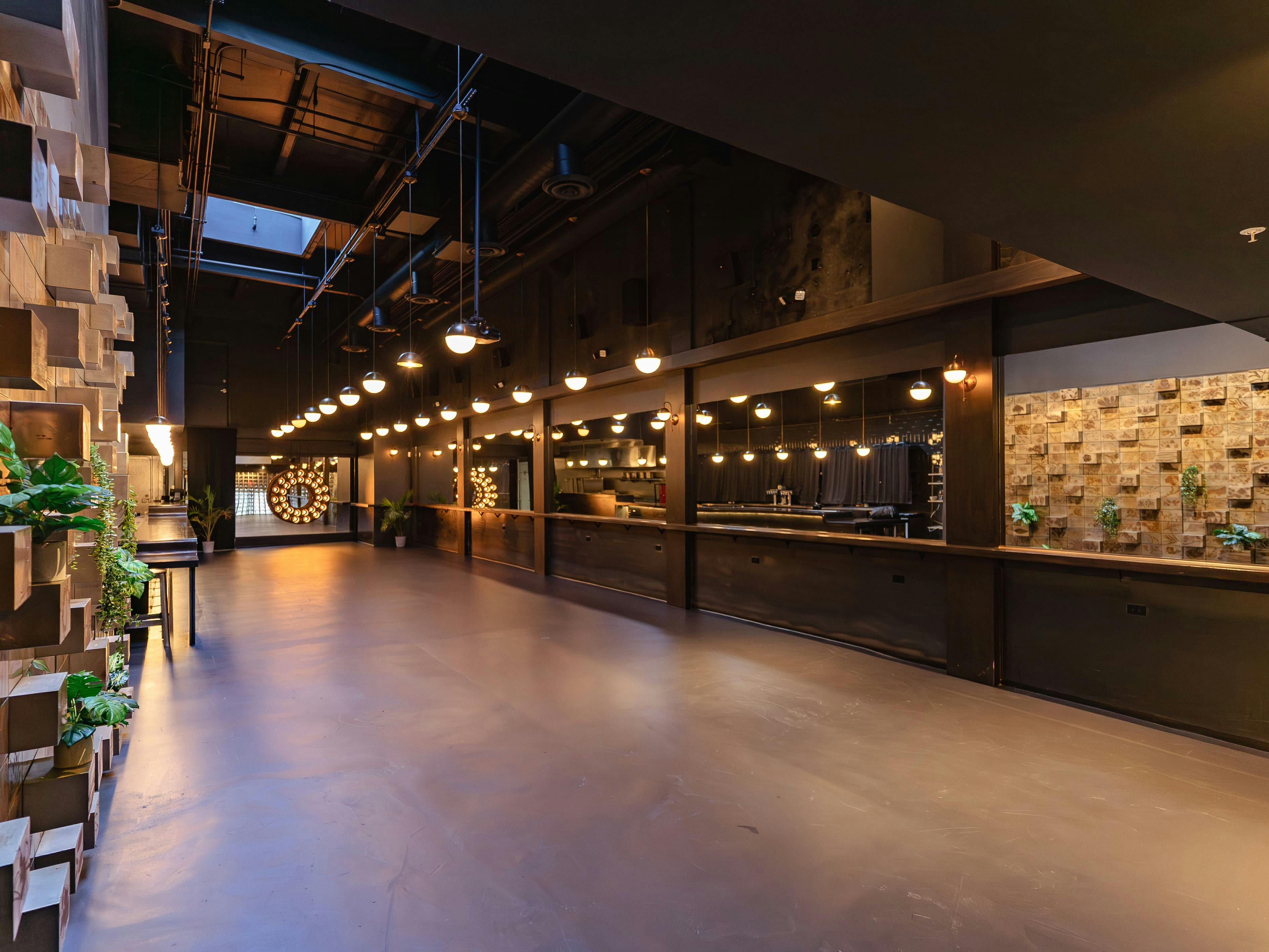 Modern industrial event space at The Pearl, ideal for networking events and receptions.